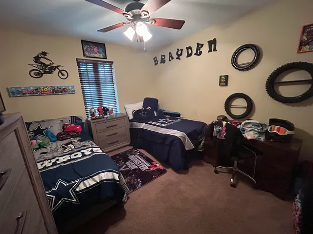 a living room with furniture a window and gym equipment