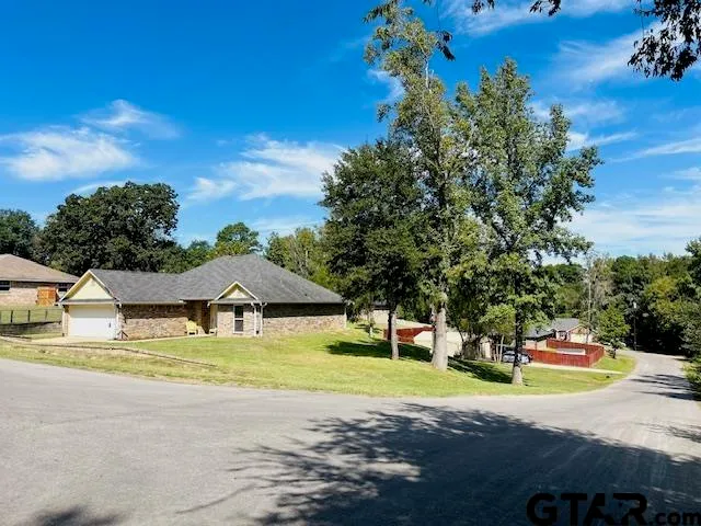 a view of a house with swimming pool and yard with green space