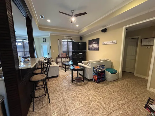 a living room with furniture and a rug