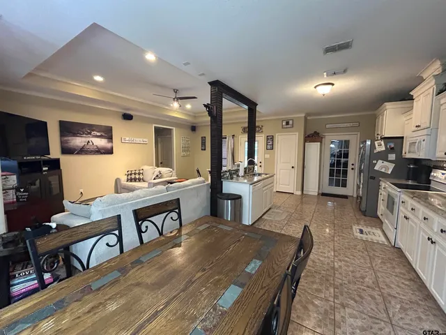 a large kitchen with lots of counter space and stainless steel appliances