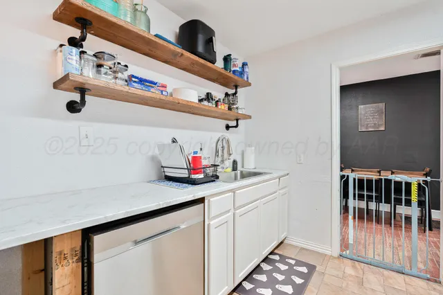 a kitchen with a cabinets and window