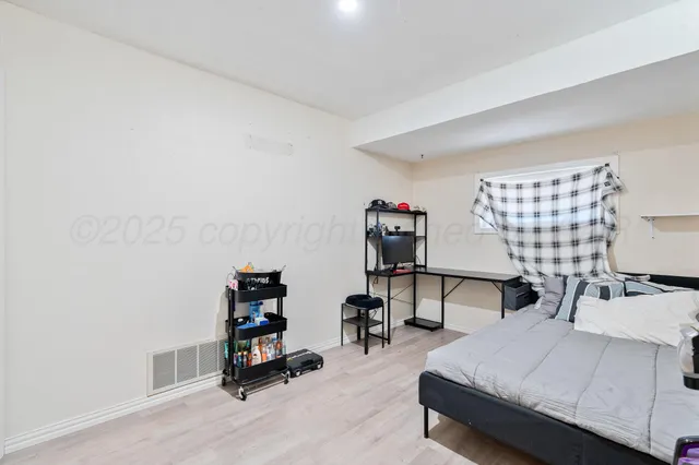 a bedroom with furniture and a bed