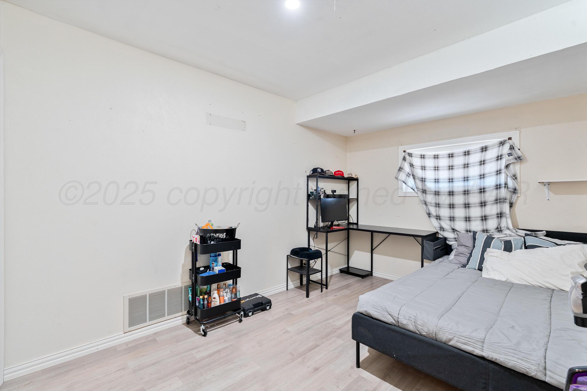 1814 Magnolia Street Amarillo, TX 79107 - Photo 18 of 26 a bedroom with furniture and a bed