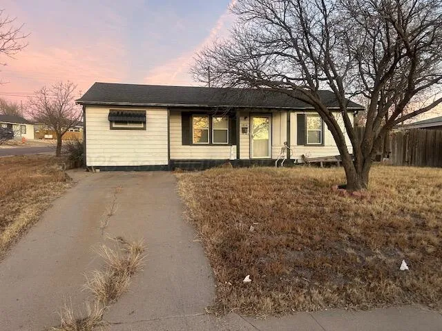 a house with trees in front of it