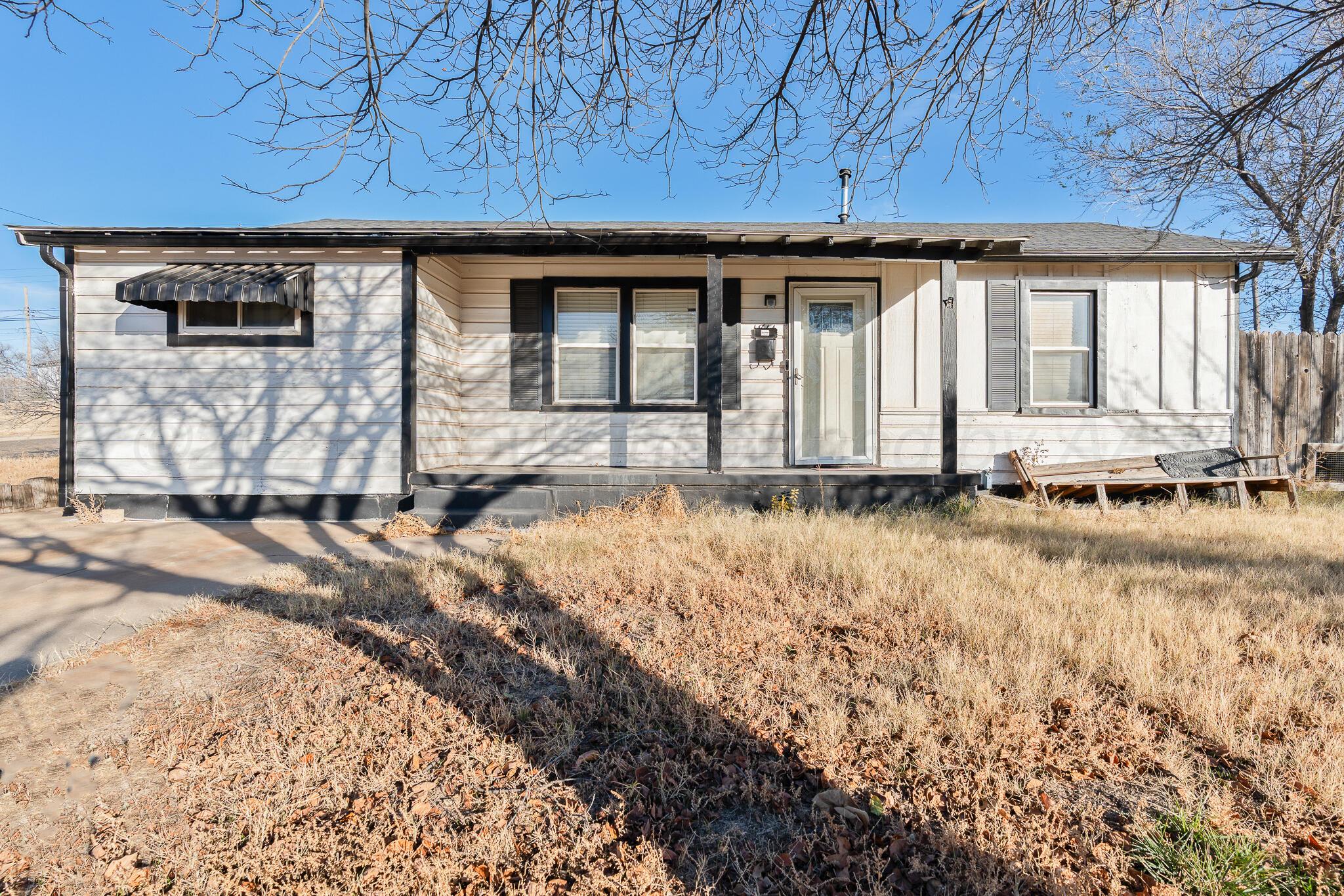 1814 Magnolia Street Amarillo, TX 79107 - Photo 3 of 26 a view of a house with a yard