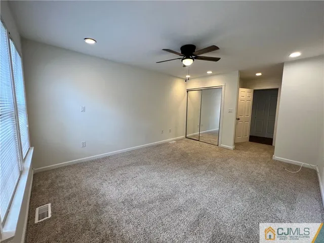 a white toilet sitting next to a bathroom sink