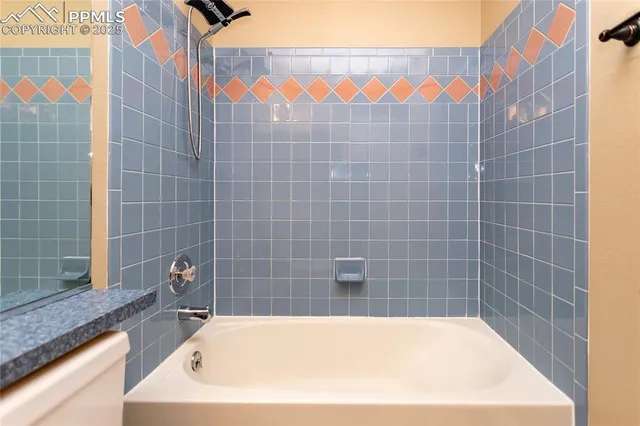 a bathroom with a bathtub and a sink