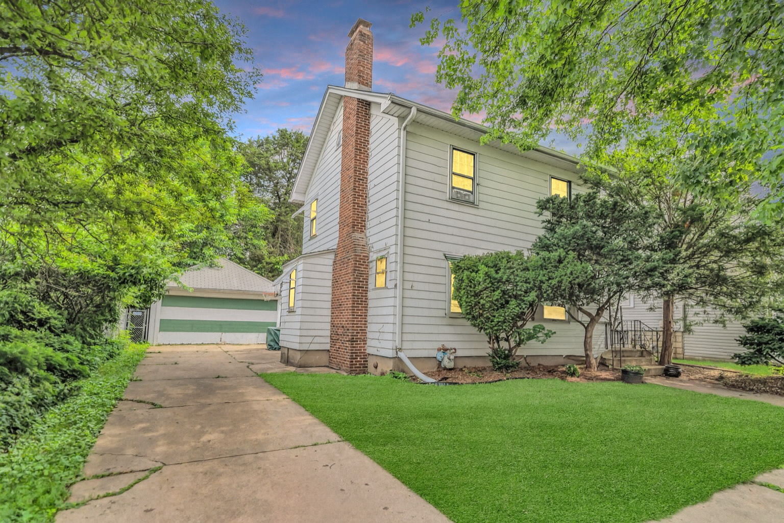 624 Lincoln Avenue Elgin, IL 60120 - Photo 1 of 24 a front view of a house with a garden and yard