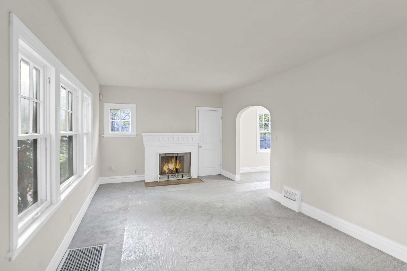 624 Lincoln Avenue Elgin, IL 60120 - Photo 4 of 24 a view of an empty room with a fireplace and a window