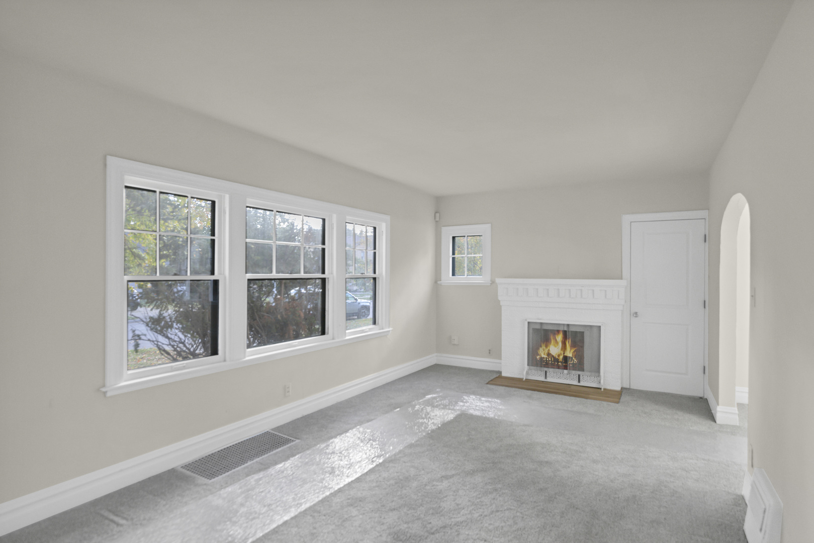 624 Lincoln Avenue Elgin, IL 60120 - Photo 5 of 24 a view of an empty room with a window and a fireplace