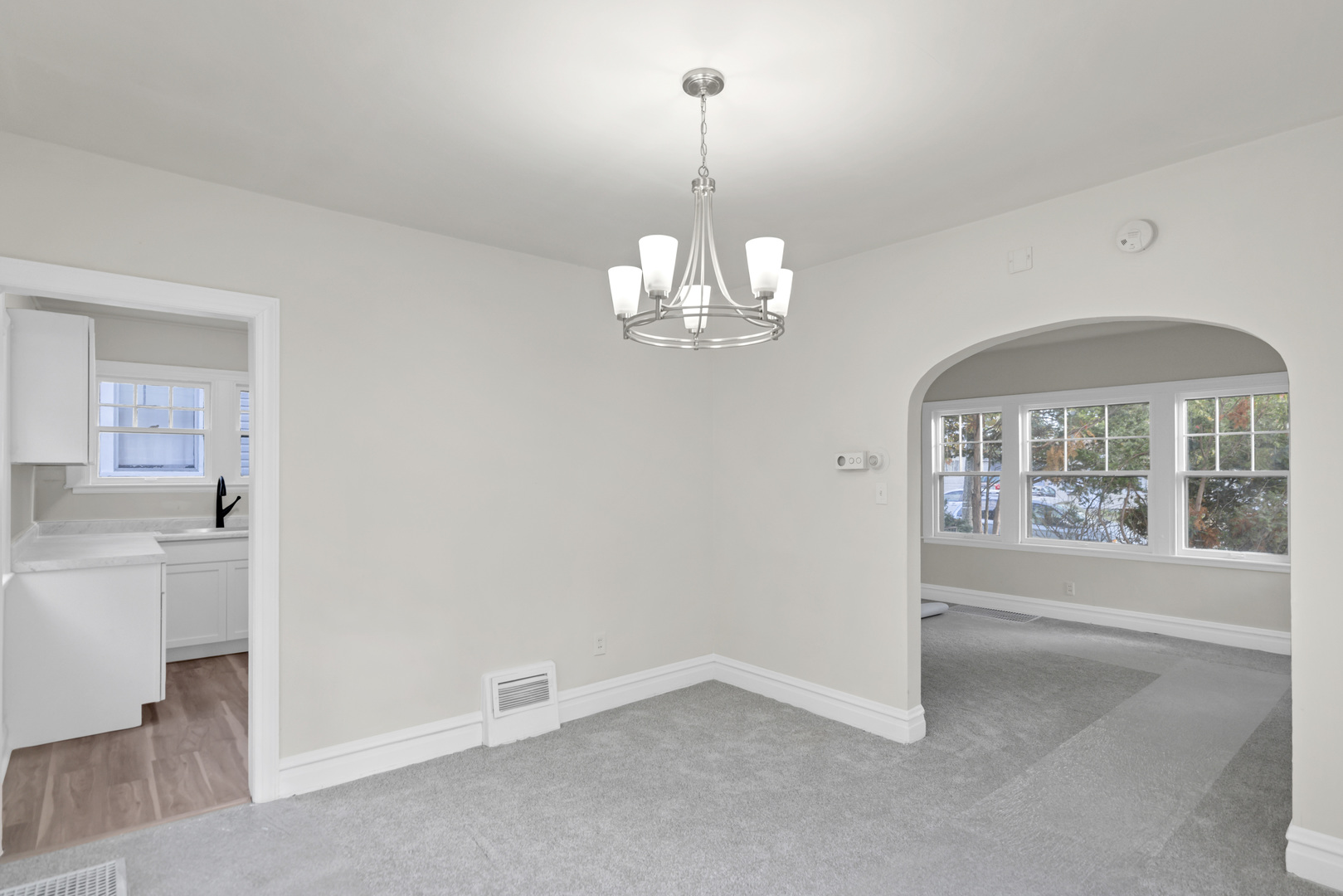 624 Lincoln Avenue Elgin, IL 60120 - Photo 8 of 24 wooden floor in an empty room with a window