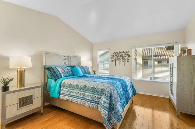 a spacious bedroom with a bed and a window