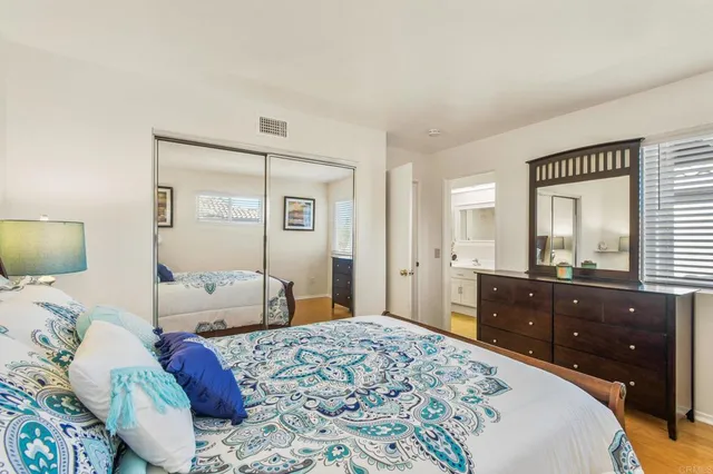 a bedroom with a bed and a dresser