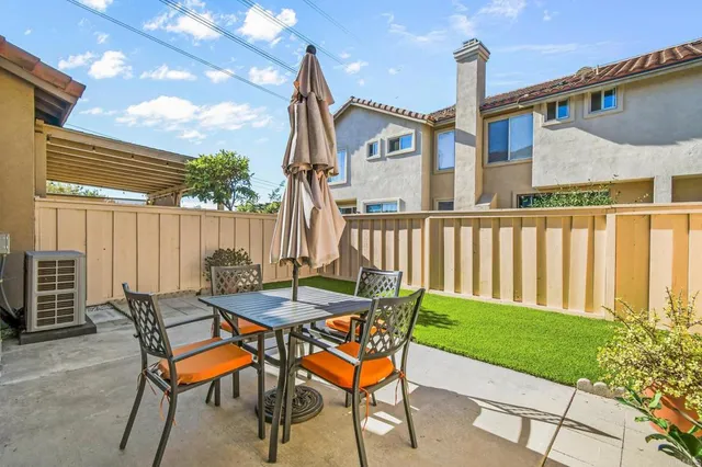 a patio with table and chairs