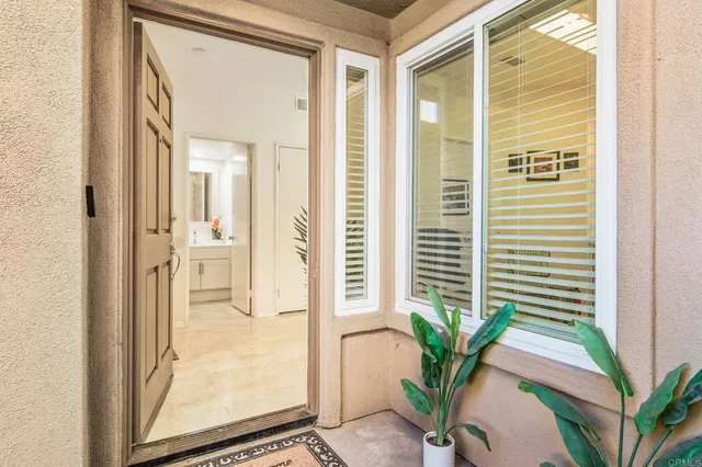a view of a potted plant in front of a door