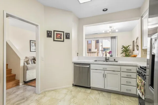 a spacious bathroom with a granite countertop sink a mirror and a