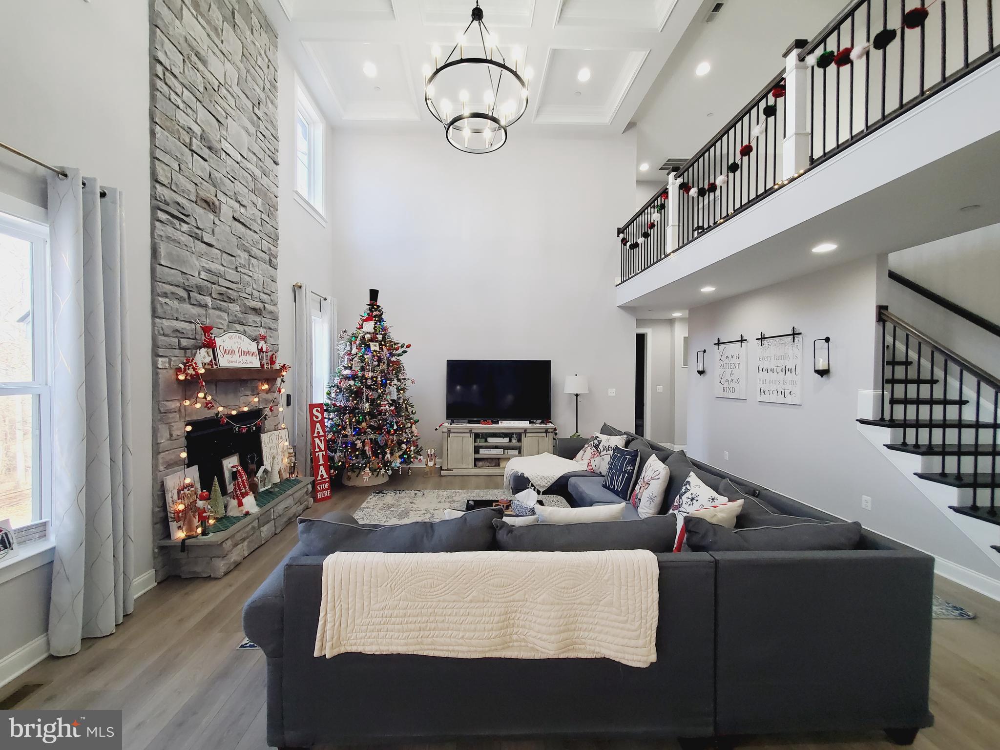 520 Walters Mill Road Forest Hill, MD 21050 - Photo 20 of 71 a living room with furniture a fireplace and a chandelier