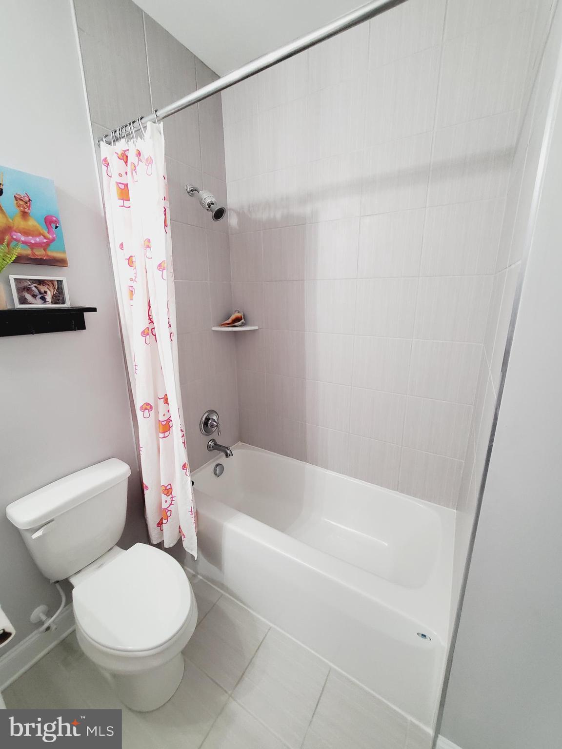 520 Walters Mill Road Forest Hill, MD 21050 - Photo 48 of 71 a white toilet sitting next to a bath tub and a shower