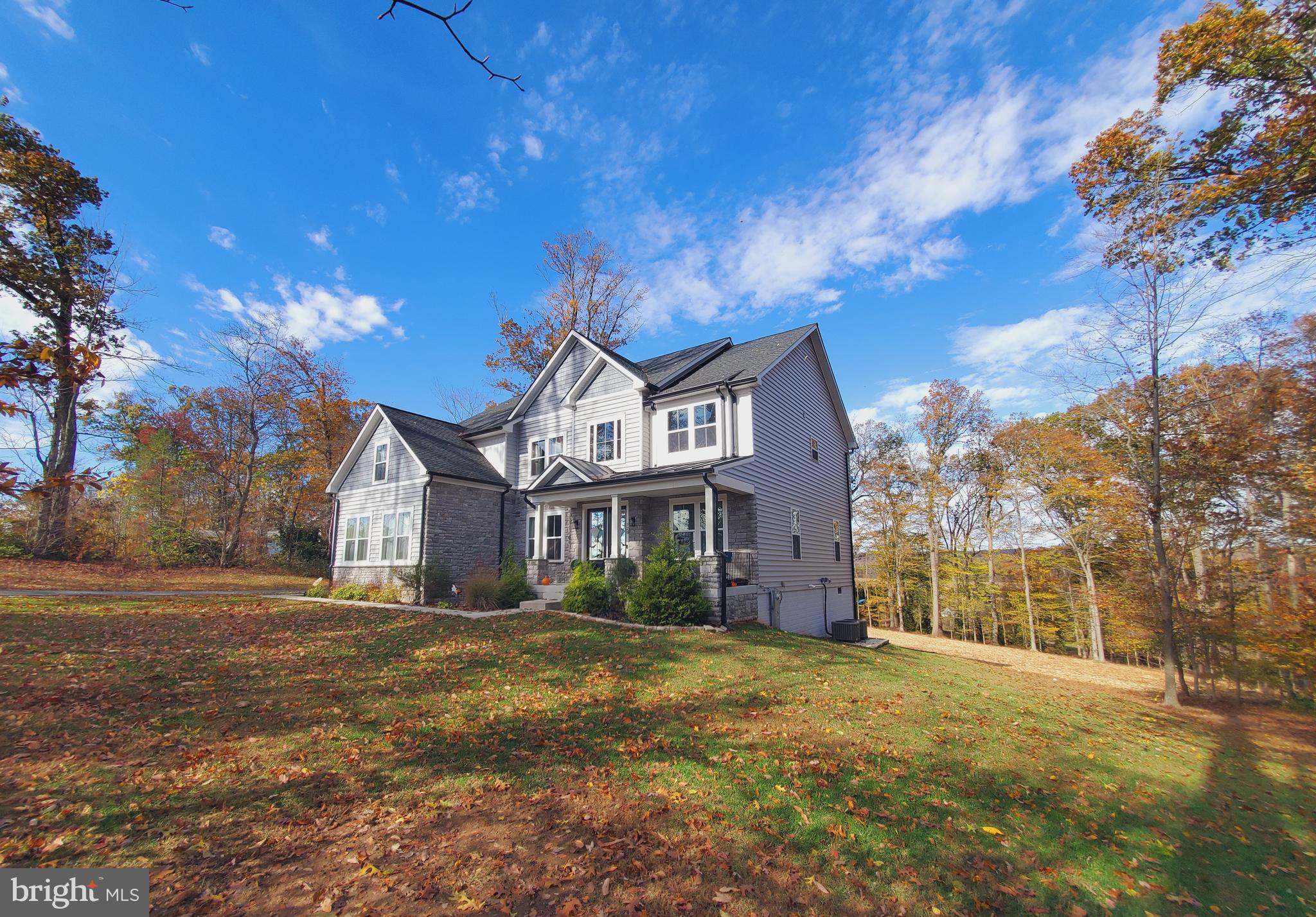 520 Walters Mill Road Forest Hill, MD 21050 - Photo 6 of 71 a front view of a house with a garden