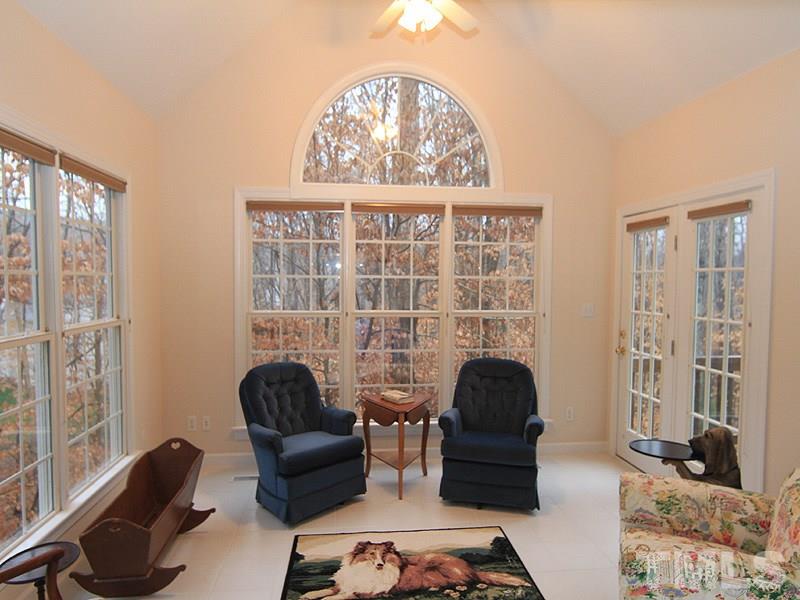 2937 Sunnystone Way Raleigh, NC 27613 - Photo 14 of 25 a living room with furniture and a large window