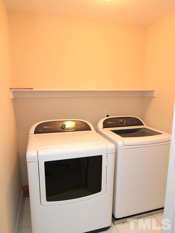 2937 Sunnystone Way Raleigh, NC 27613 - Photo 22 of 25 a utility room with dryer and washer