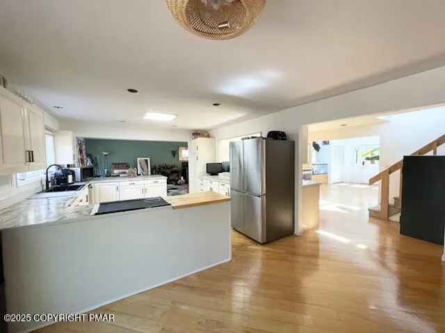 a bathroom with a glass shower door