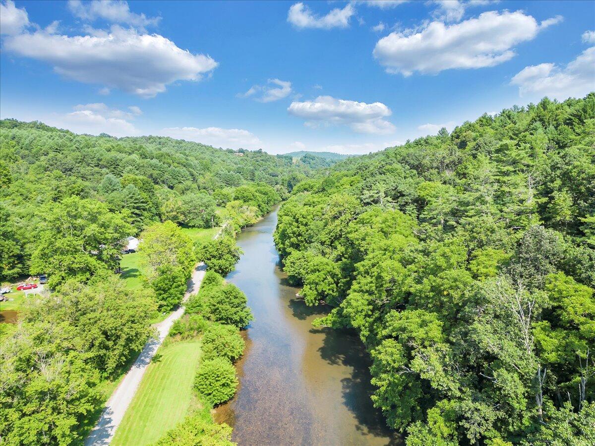 0 Sowers Mill Dam Drive Northeast Riner, VA 24149 - Photo 20 of 25 a view of a lake with a yard