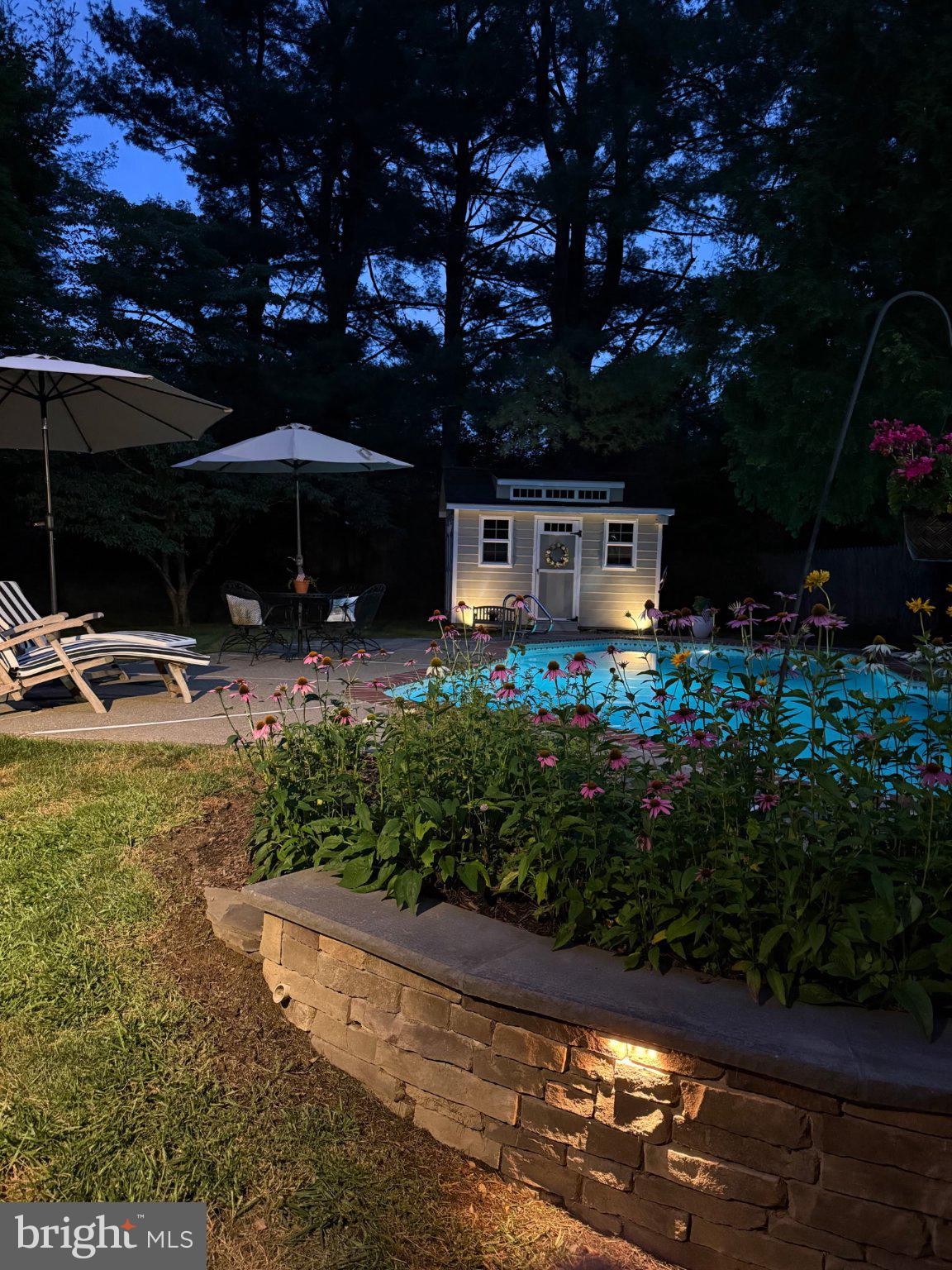17 Stringer Drive Doylestown, PA 18901 - Photo 76 of 80 Serene evening by the illuminated pool.