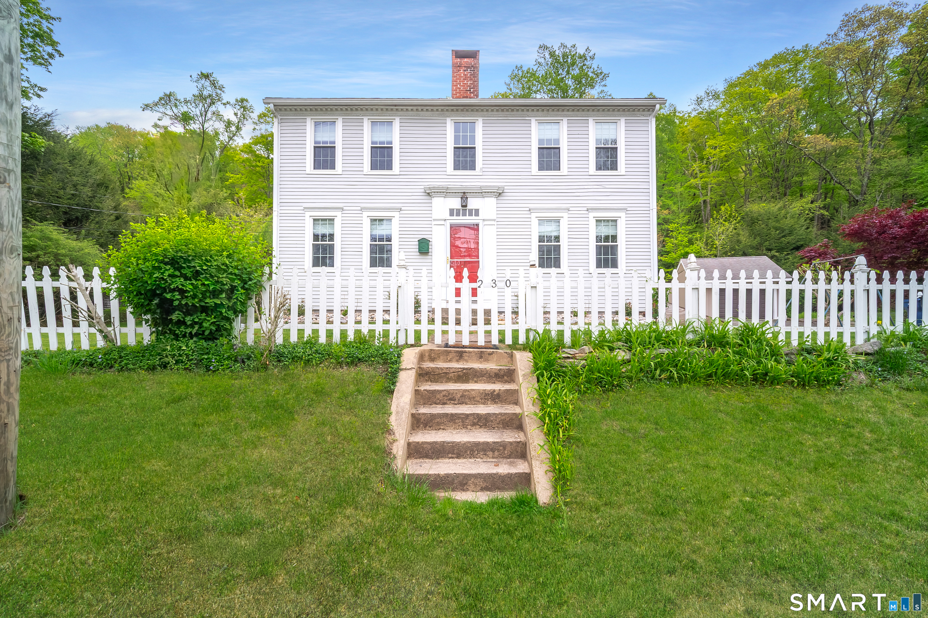 230 Killingworth Road Haddam, CT 06441 - Photo 36 of 36 a front view of a house with a garden