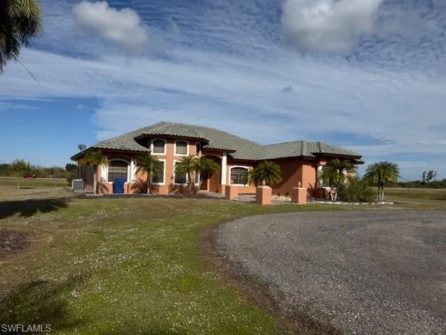 a view of a house with a yard