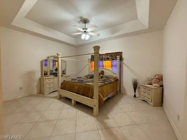 a bedroom with a bed and a television