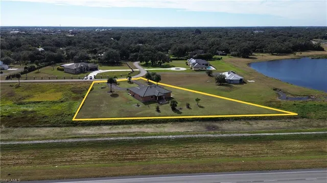 an aerial view of a house with a swimming pool
