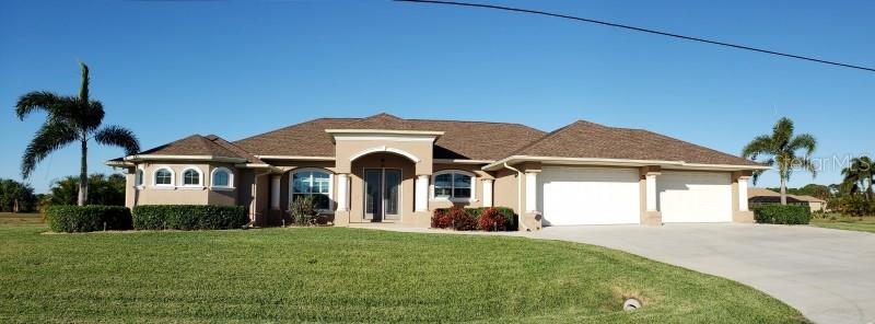 179 Tournament Road Rotonda West, FL 33947 - Photo 1 of 1 a front view of a house with a yard