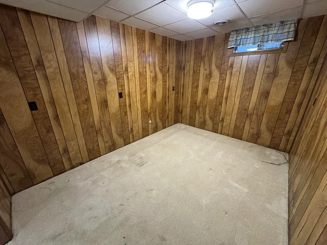 a view of a patio with a table and chairs