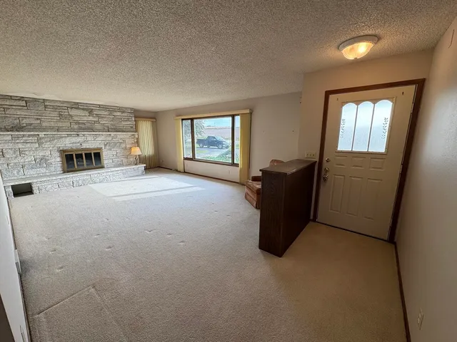 a view of a livingroom with a fireplace