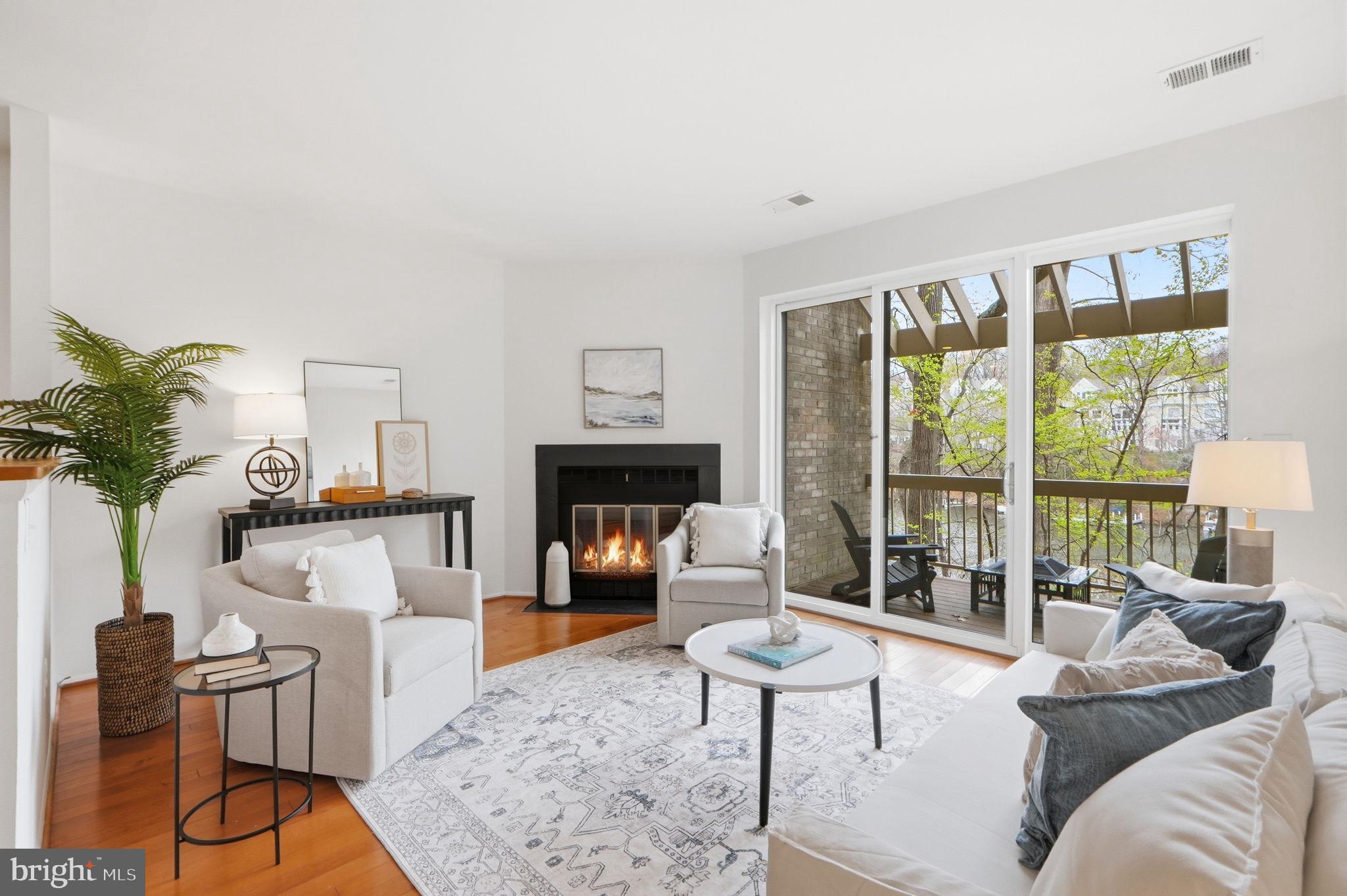 11124 Boathouse Court, Unit 89 Reston, VA 20191 - Photo 4 of 35 Light filled living room with balcony access