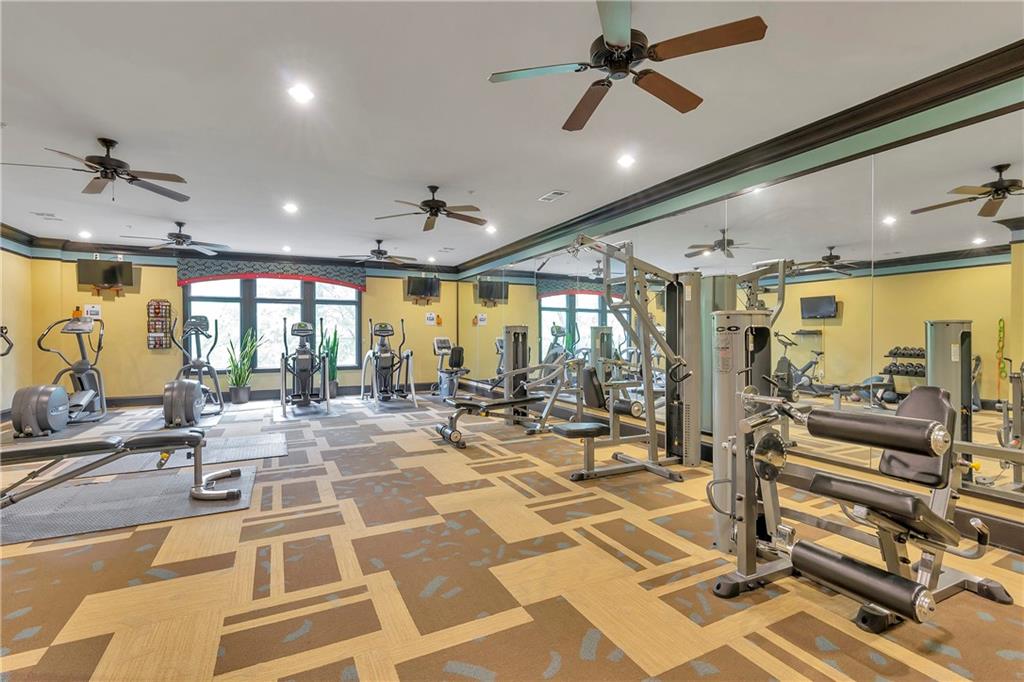 3635 East Paces Circle, Unit 1109 Atlanta, GA 30326 - Photo 21 of 22 a view of a room with gym equipment