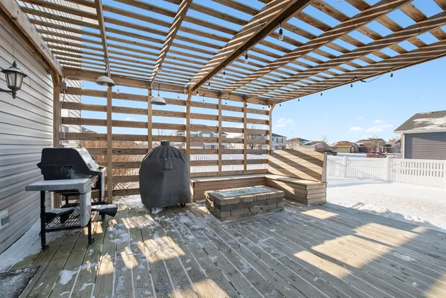 a view of a backyard with seating space