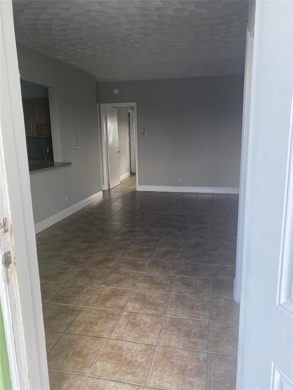 800 Northeast 13th Street, Unit 6 Fort Lauderdale, FL 33304 - Photo 2 of 13 a view of an empty room and window