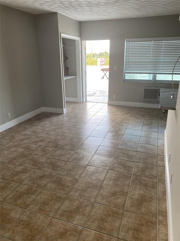 800 Northeast 13th Street, Unit 6 Fort Lauderdale, FL 33304 - Photo 6 of 13 a view of an empty room and a window