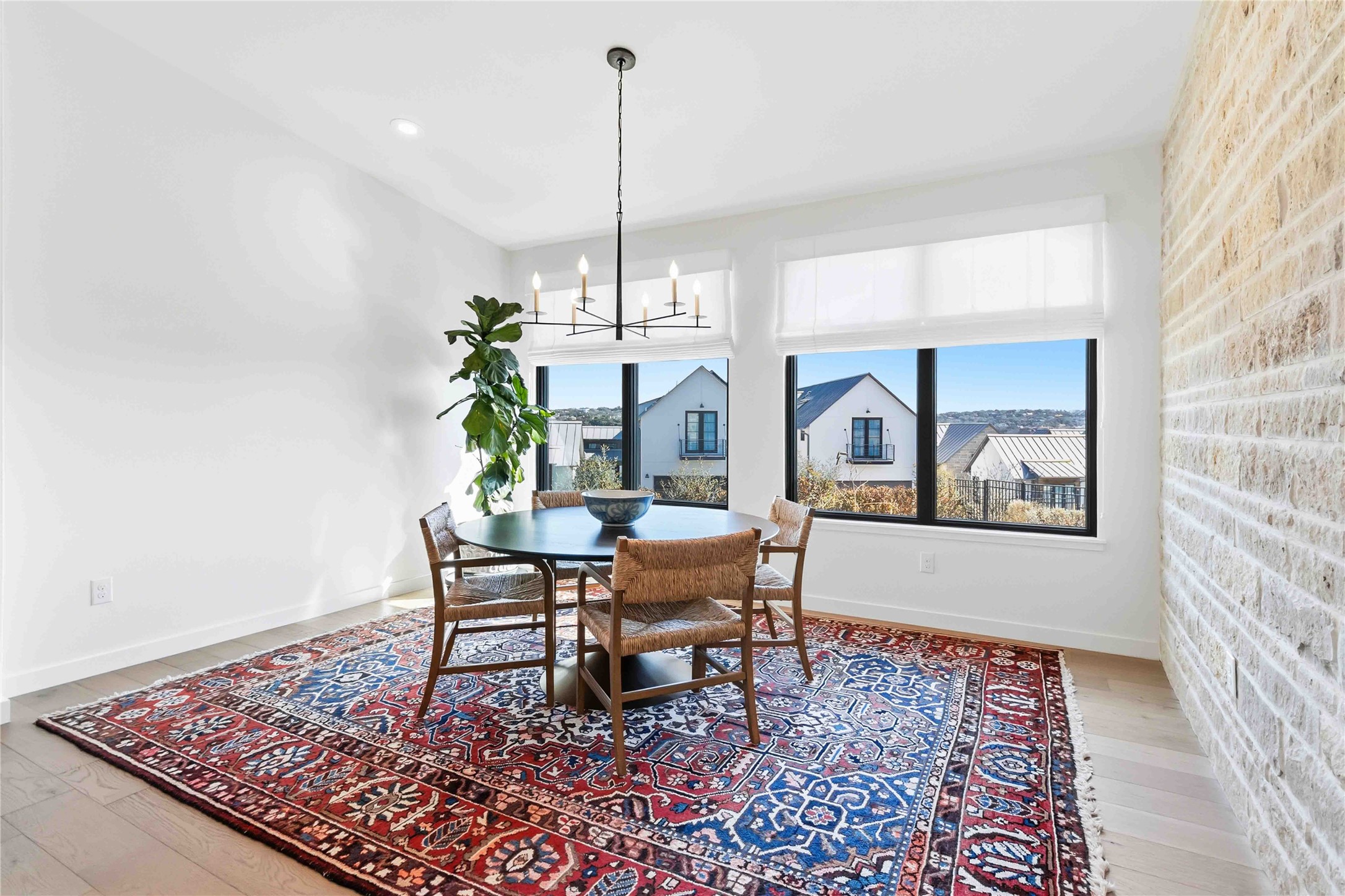 410 Kayak Way Austin, TX 78738 - Photo 15 of 40 a living room with a table or chandelier and a rug