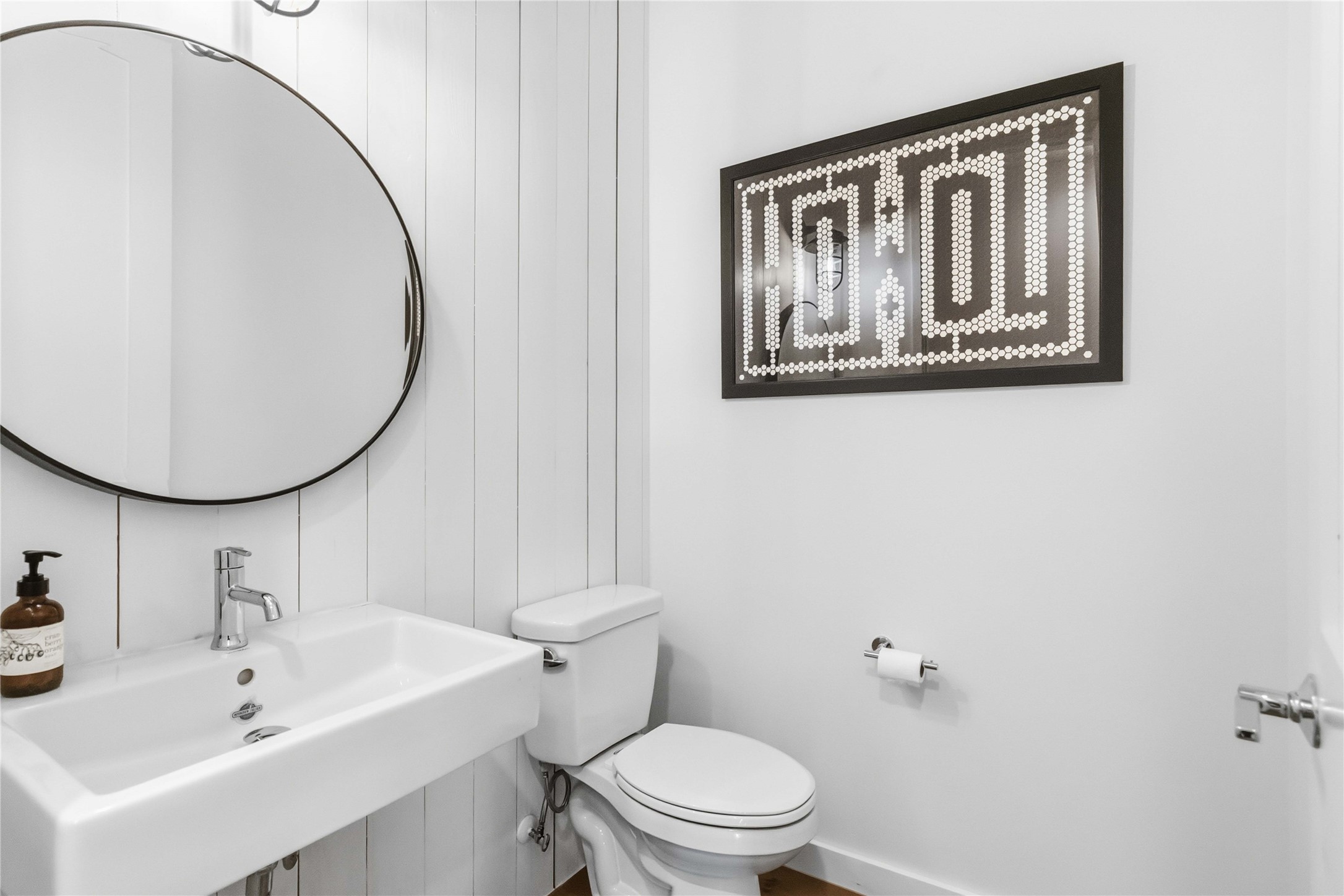 410 Kayak Way Austin, TX 78738 - Photo 16 of 40 a bathroom with a toilet a sink and a mirror