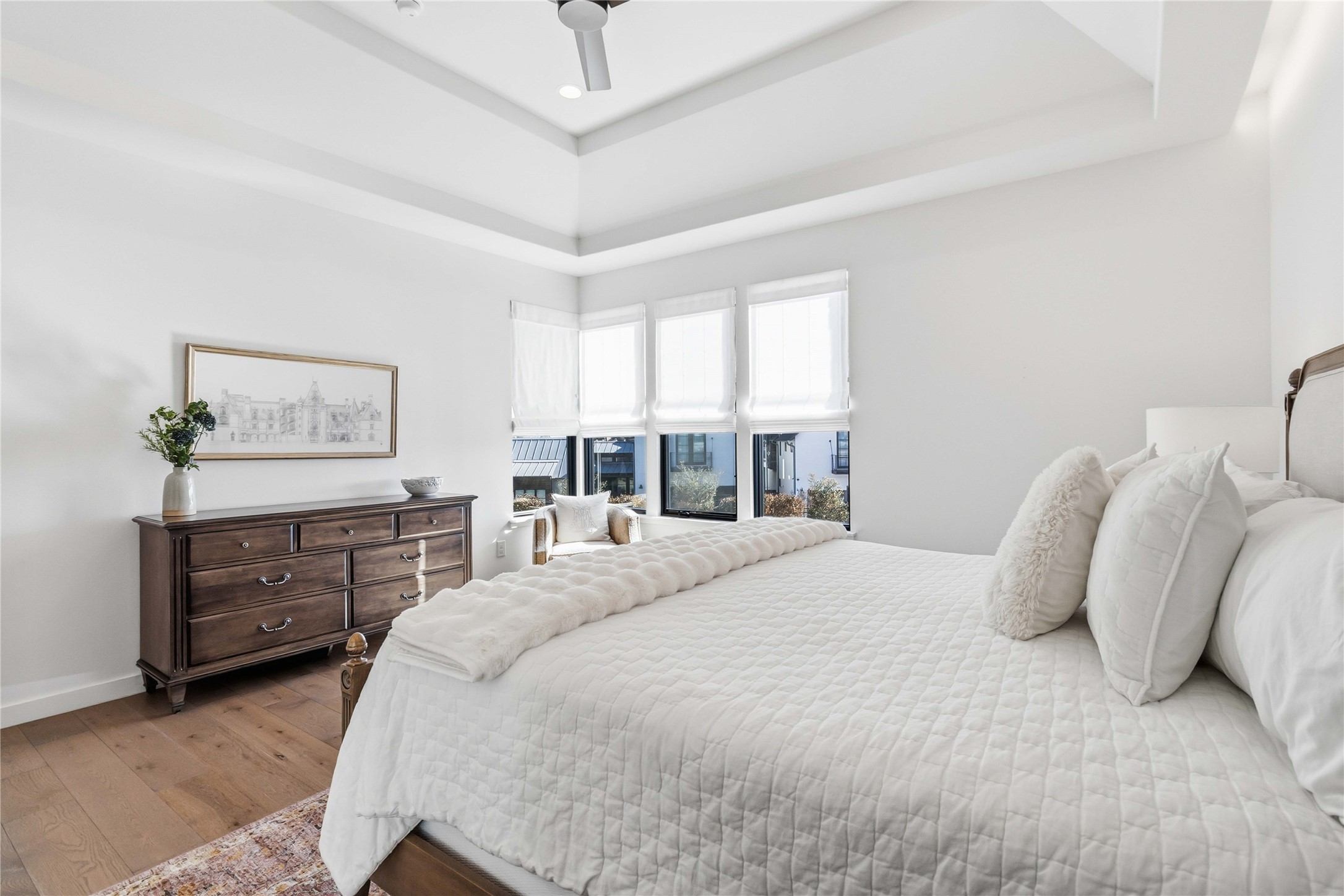 410 Kayak Way Austin, TX 78738 - Photo 19 of 40 a bedroom with a large bed and a dresser