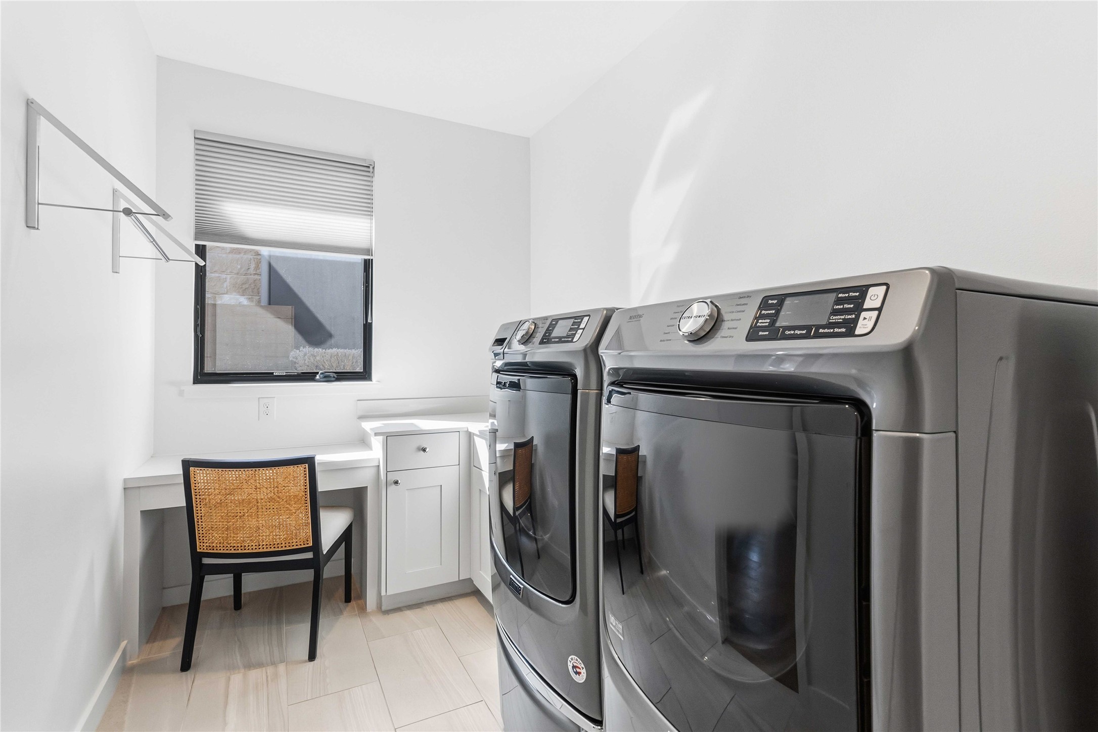 410 Kayak Way Austin, TX 78738 - Photo 28 of 39 Laundry room with washing machine and clothes dryer, an office area, and cabinet space