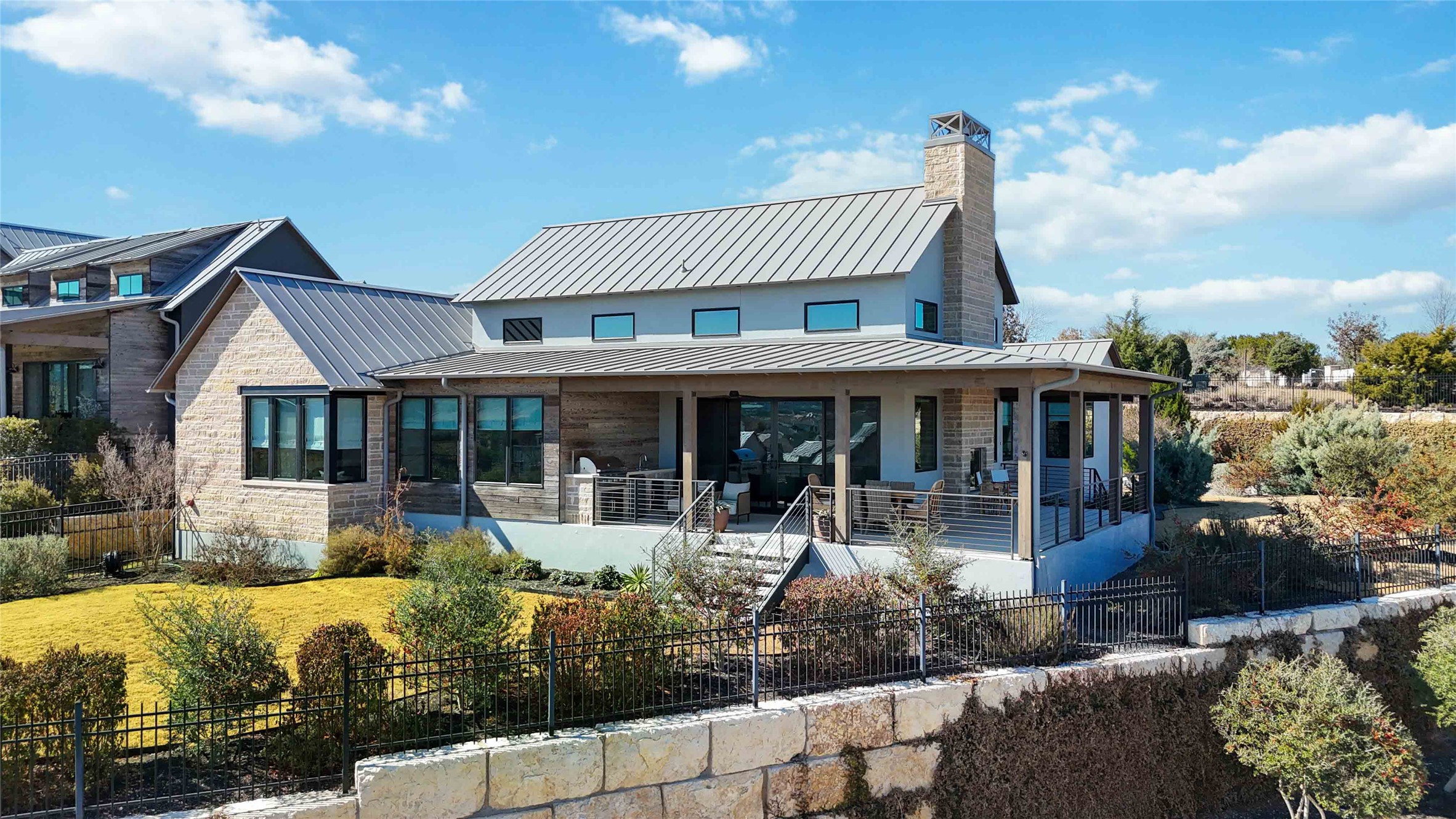 410 Kayak Way Austin, TX 78738 - Photo 38 of 40 a front view of a house with a yard patio and outdoor seating