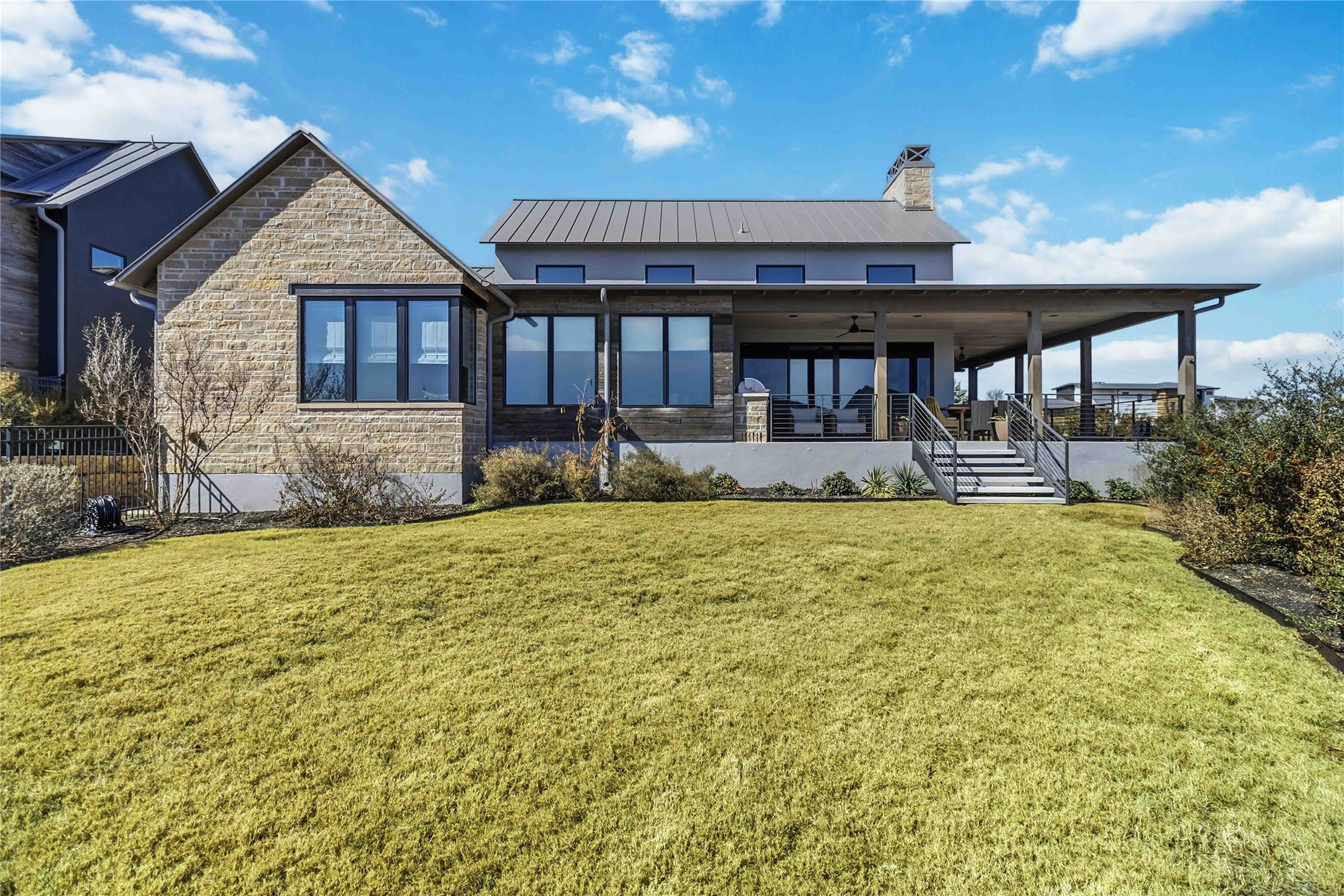 410 Kayak Way Austin, TX 78738 - Photo 4 of 40 a front view of a house with garden