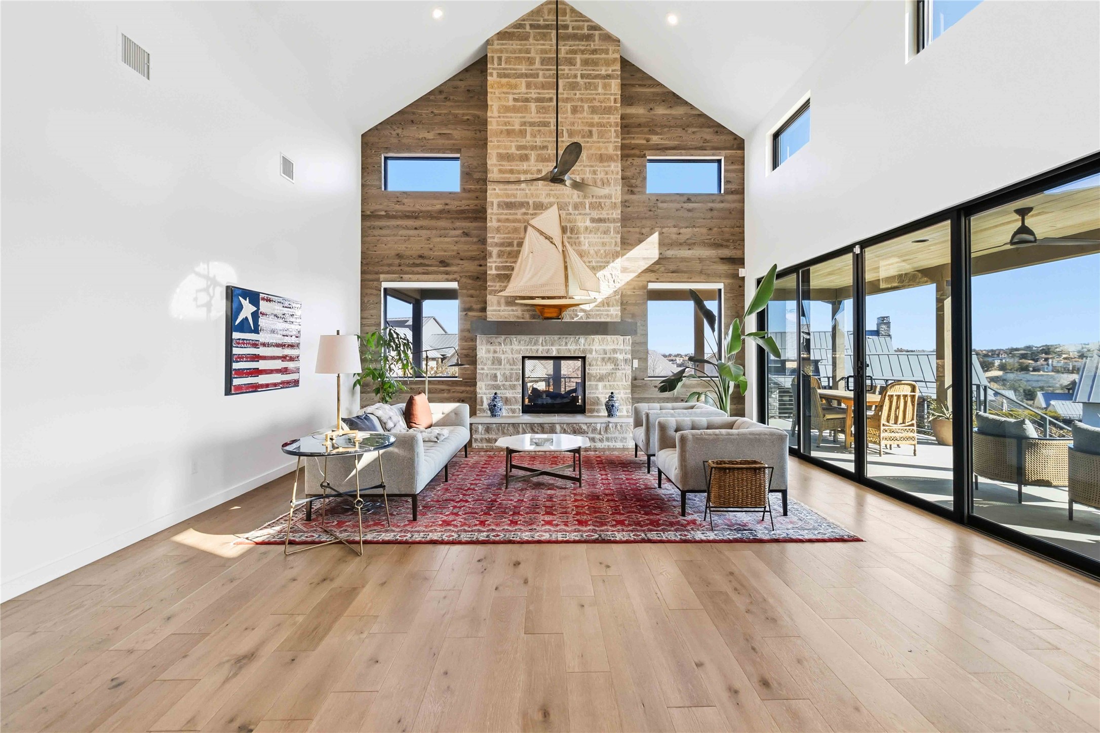 410 Kayak Way Austin, TX 78738 - Photo 8 of 40 a living room with fireplace furniture and a large window