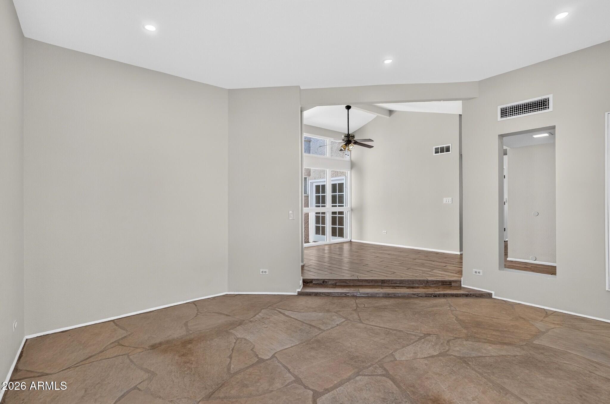 4615 East Monte Way Phoenix, AZ 85044 - Photo 31 of 35 an empty room with cabinet and mirrors