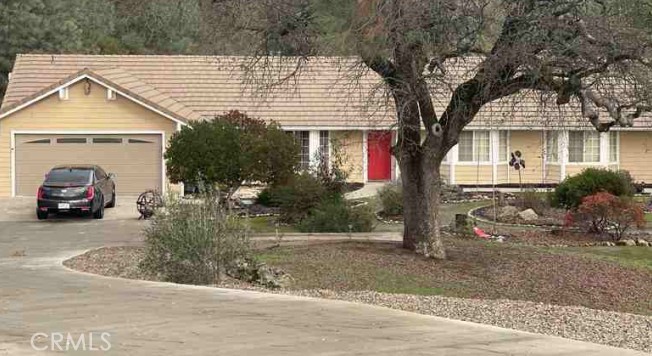 28899 Limestone Way Coarsegold, CA 93614 - Photo 2 of 3 a view of a house with a patio