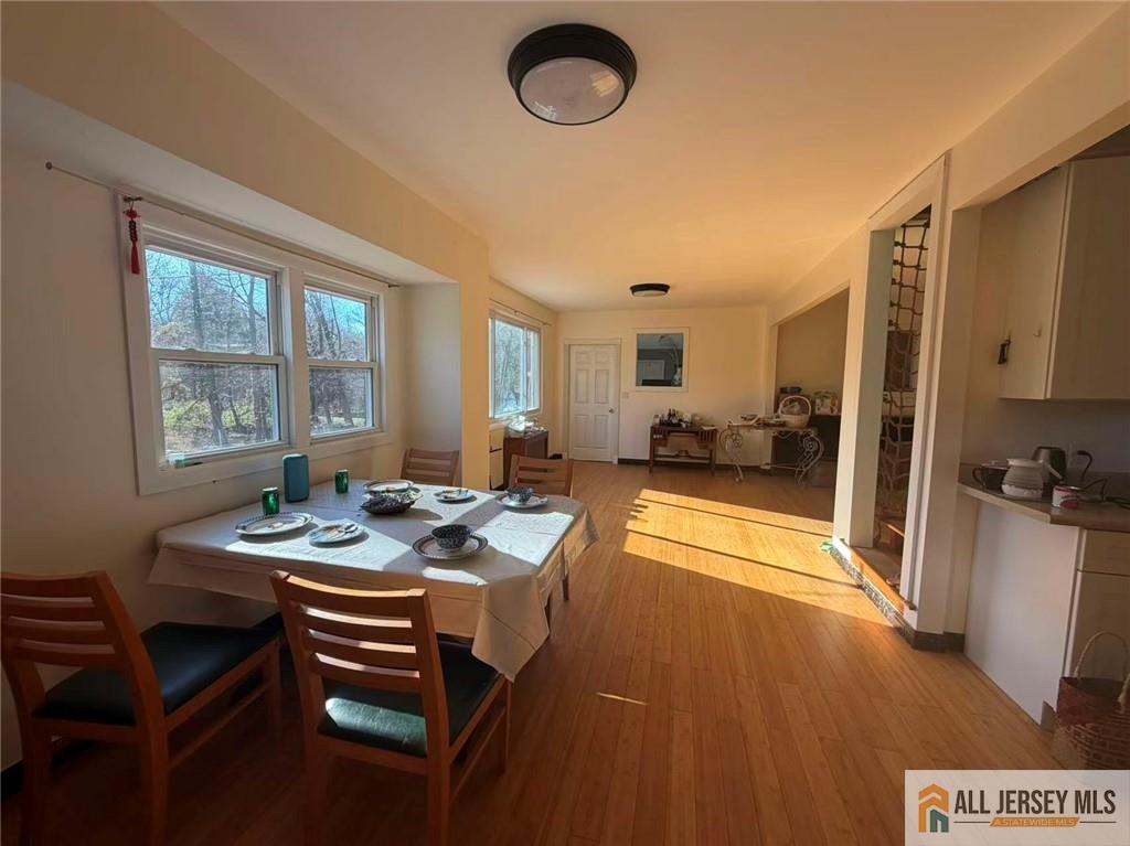 57 North Disbrow Hill Road Monroe Township, NJ 08831 - Photo 3 of 24 a dining room with furniture and a floor to ceiling window